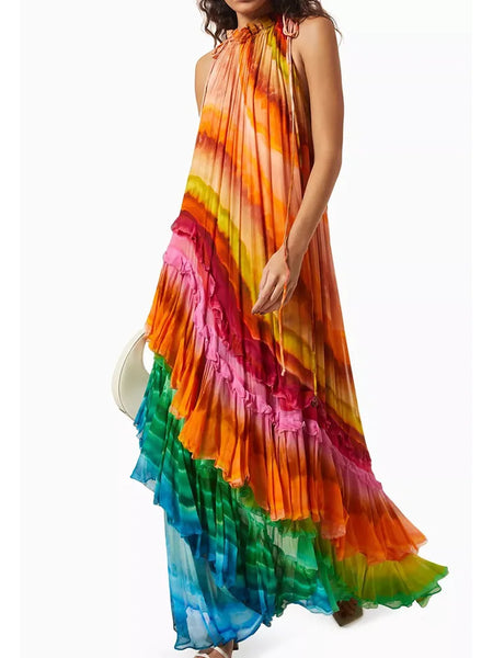 Woman wearing a colorful, tiered dress with a white background